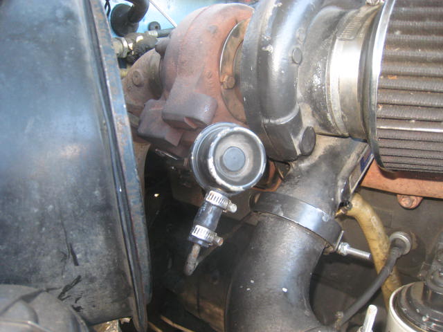 Turbocharger with intake piping and air filter, close-up engine view