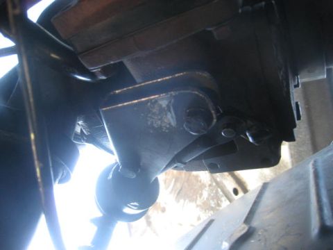 1976 Ford F-250 - A close-up shot reveals the complex mechanical parts underneath a vehicle.