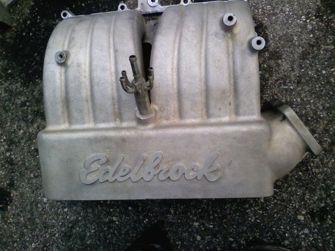 1990 Ford Bronco - An Edelbrock intake manifold is shown, with the brand name clearly visible on its surface.