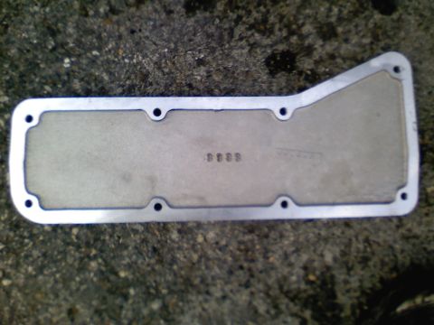 1990 Ford Bronco - Transmission pan gasket with stamped numbers '0009' visible.