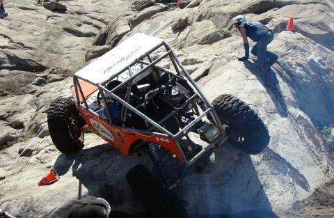1970 Mercury Cougar - A custom-built off-road vehicle navigates a challenging rocky terrain during an event.