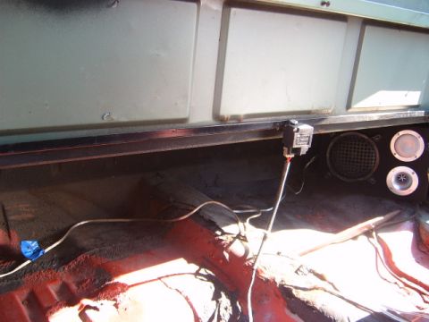 1973 Ford Ranchero - Vehicle interior with aftermarket speakers and visible wiring, showing red floor carpeting.
