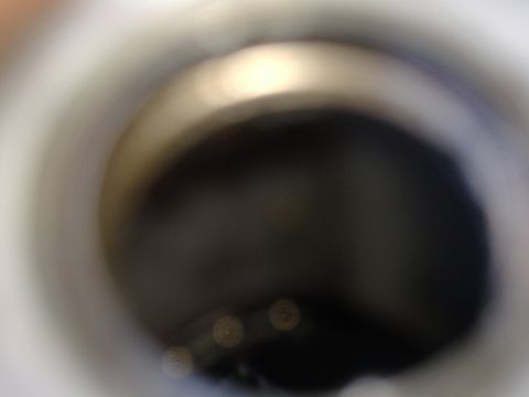 1995 Ford F-150 - A blurry close-up of a vehicle part, possibly from the steering column area.