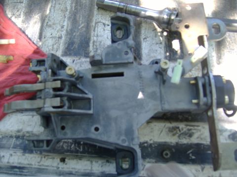 1995 Ford F-150 - This is a close-up view of a vehicle's steering column assembly, showing mechanical components.