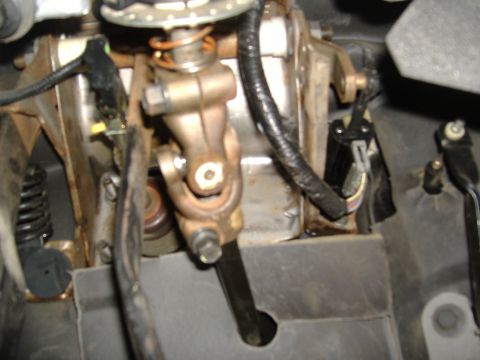 1995 Ford F-150 - Close-up view of the steering column's universal joint and associated linkage components.