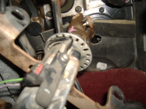 1995 Ford F-150 - Close-up view of the steering column assembly, showing various mechanical and electrical components.