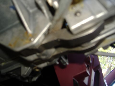 1995 Ford F-150 - Underside view of metallic components, possibly from a vehicle's steering column.