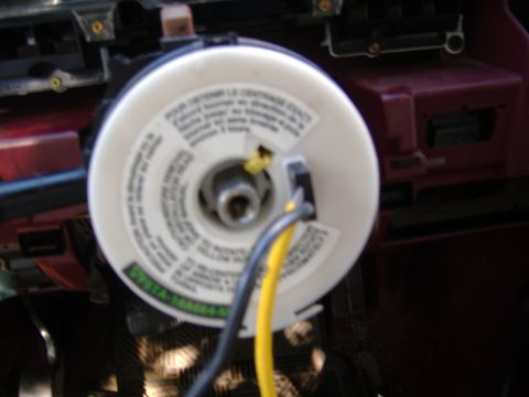 1995 Ford F-150 - Close-up of a steering column component, showing wiring and a part number label.