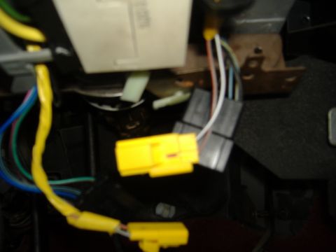 1995 Ford F-150 - Close-up of wiring harness and connectors beneath the steering column.