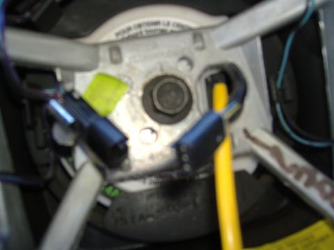 1995 Ford F-150 - Close-up view of the wiring harness connected to the steering column.
