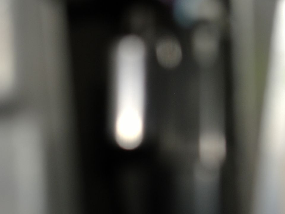 blurry shot of a steering column interior with a bright light
