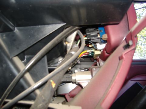 1995 Ford F-150 - Wiring and electrical connectors are visible beneath the steering column of the vehicle.