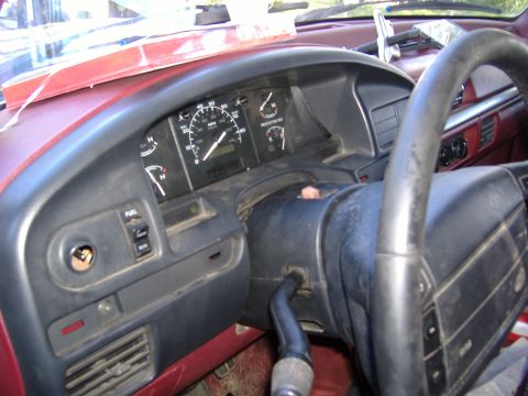 1995 Ford F-150 - The interior of a 1995 Ford F-150, focusing on the dashboard and steering wheel area.