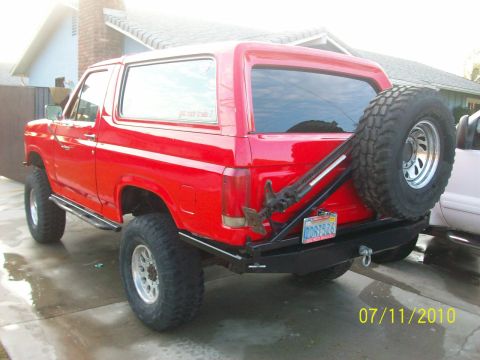 1985 Ford Bronco - This red Ford Bronco appears to be from the early 1980s, not a 1985 model.