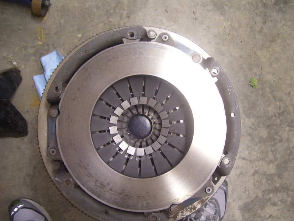 Clutch disc and pressure plate assembly on concrete floor