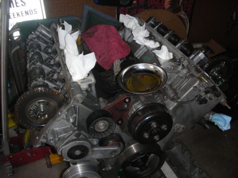 1992 Ford Crown Victoria - Engine components are visible, including camshafts and pulleys, with a small pan of oil.