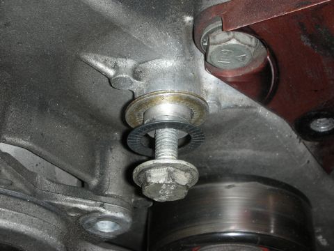 1992 Ford Crown Victoria - Close-up view of a bolt and washers on an engine component.