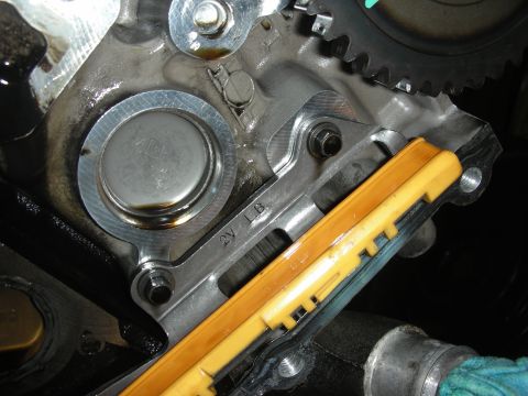 1992 Ford Crown Victoria - Engine timing chain tensioner and guide assembly detail, showing part markings.