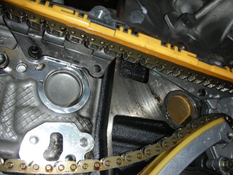 1992 Ford Crown Victoria - Close-up view of an engine's timing chain and valve mechanism.