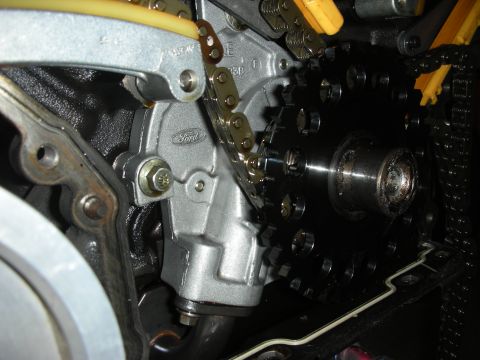 1992 Ford Crown Victoria - Ford engine timing chain and gears with visible Ford logo on housing.