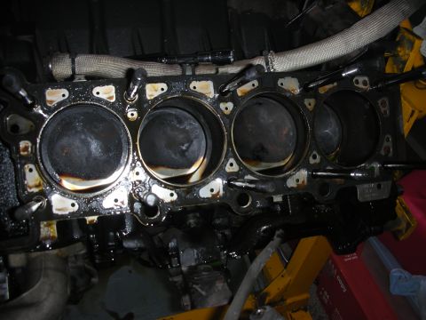 1992 Ford Crown Victoria - Close-up view of an engine block with pistons, indicating internal engine work or damage.