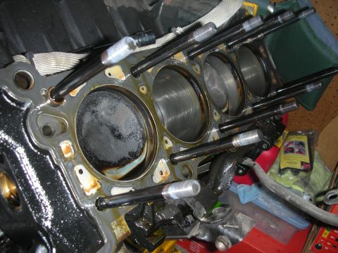 1992 Ford Crown Victoria - Engine block with pistons and head bolts, likely during a rebuild or repair process.