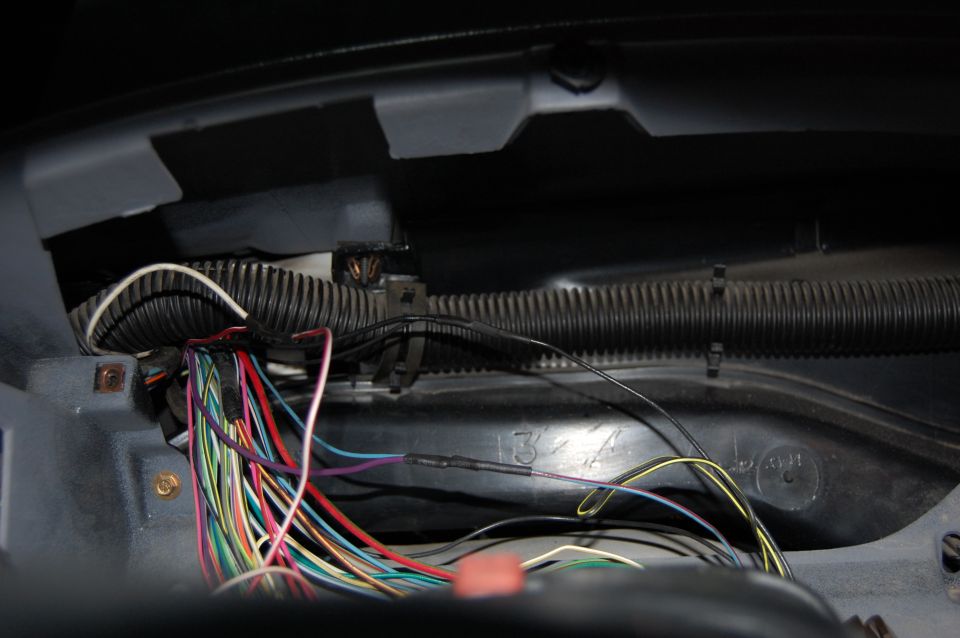 Wires tapped for Transmission Temperature Gauge. 

RD/WHT - Coolant temperature signal
BLK - Instrument cluster ground
BLU/RD - Instrument panel illumination