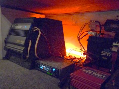 2006 Ford E350 - Car audio equipment including amplifiers, a stereo, and a power inverter is visible.