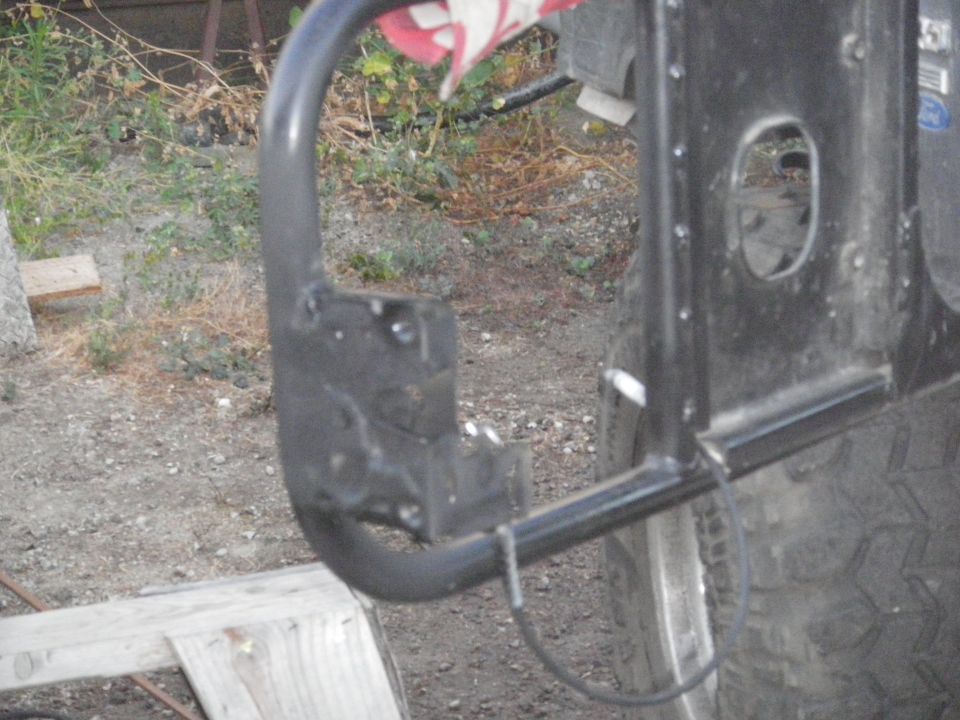 Black metal bumper attached to a tire on a vehicle