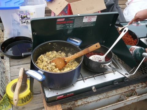 1988 Ford Bronco - Cooking breakfast on a Coleman propane stove outdoors.