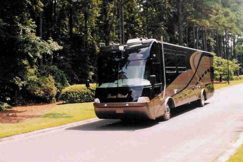 2001 Ford Crown Victoria - Terra Wind RV on a road.