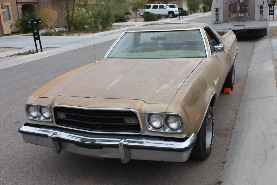 1973 Ford Ranchero pickup, tan paint, parked on street