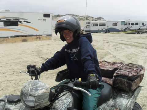 1991 Ford F-350 - Person on an ATV at the beach with RVs parked nearby.