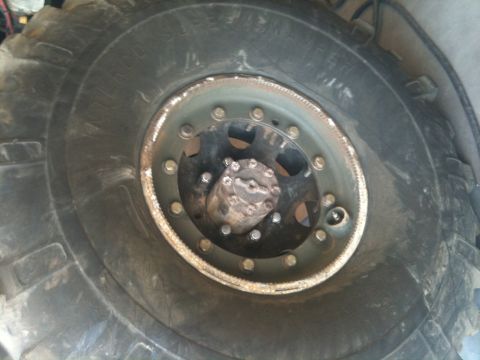 1966 Ford Bronco - This image shows a close-up of a heavy-duty tire and wheel, not a 1966 Ford Bronco.