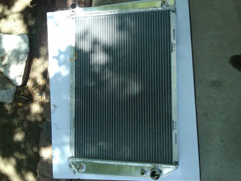 1982 Ford Bronco - This is a radiator, not a 1982 Ford Bronco. The part is shown from the front, laid flat on a white surface.