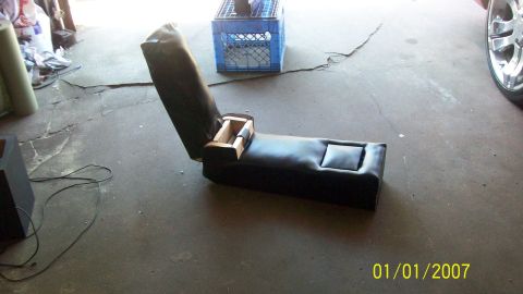 2004 Ford Crown Victoria - Custom car seat console with storage and cup holder, appears to be a project in progress.