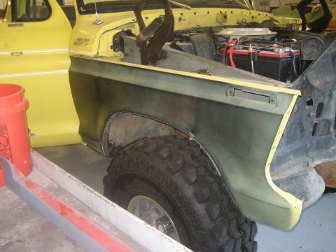 1978 Ford Bronco - This vehicle appears to be a Ford truck undergoing repairs, with its front fender area exposed.