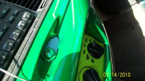 2004 Ford Crown Victoria - Close-up of a car's interior showing the dashboard with various buttons and knobs.