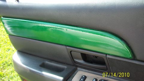 2004 Ford Crown Victoria - Custom green trim adorns the interior door panel of this 2004 Ford Crown Victoria.