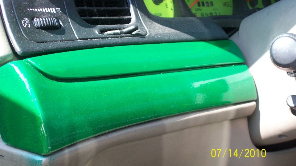 2004 Ford Crown Victoria interior with custom green painted dashboard trim and instrument cluster visible