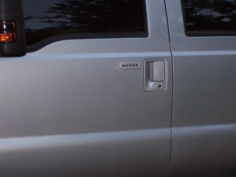 2008 Ford F-250 - Side view of a silver 2008 Ford F-250 truck door, showing the keypad entry system.