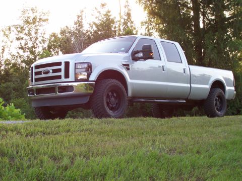 2008 Ford F-250 - Silver 2008 Ford F-250 pickup truck with aftermarket wheels and tires.