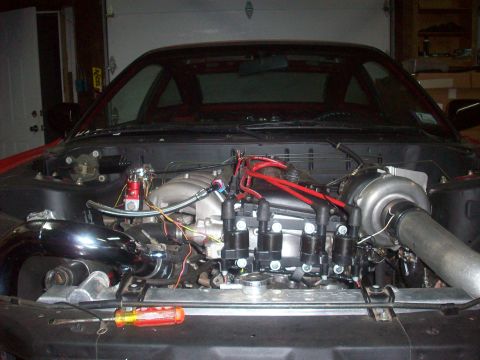 1992 Nissan 240SX - Custom engine build with a large turbocharger installed in the engine bay.