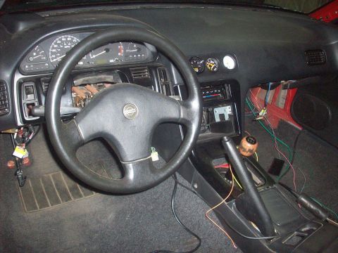 1992 Nissan 240SX - The interior of a 1992 Nissan 240SX shows a modified dashboard with extra gauges and wiring.
