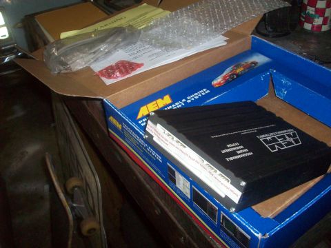 1992 Nissan 240SX - AEM programmable engine management system box with unit and warning label visible.