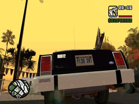 2000 Mercury Grand Marquis - This is a screenshot from a video game, showing the rear of a police car with a license plate and a humorous sticker.