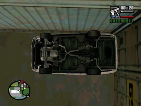 2000 Mercury Grand Marquis - The underside of a white sedan is visible, displaying its exhaust system and suspension components.