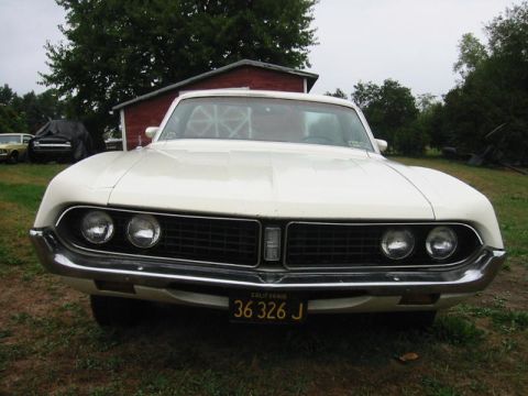 1971 Ford Ranchero - A white 1970 pickup truck is parked in front of a red barn, with a California license plate visible.