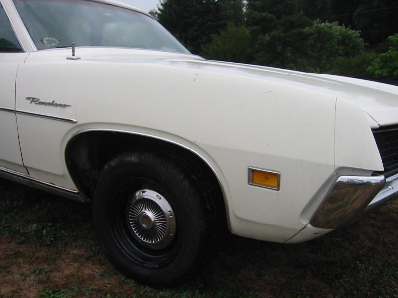 White Ford Ranchero fender and front bumper, close-up
