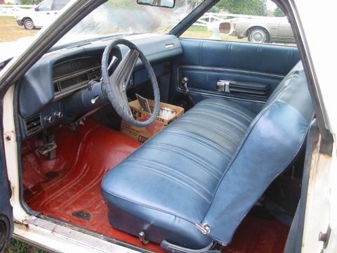 1971 Ford Ranchero - Interior view of a 1972 Ford Ranchero, showing the blue seats and dashboard.